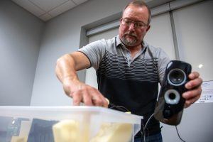 Steve Kinne packs his audio equipment at the Manlius Public Library on March 19.