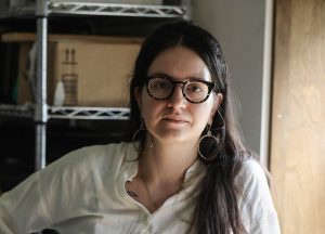 Clara Riedlinger in her studio at Rochester Contemporary Art Center is one of the Erie Canal artists in residence. She is a photographer and uses different format cameras from film to digital and also includes video.