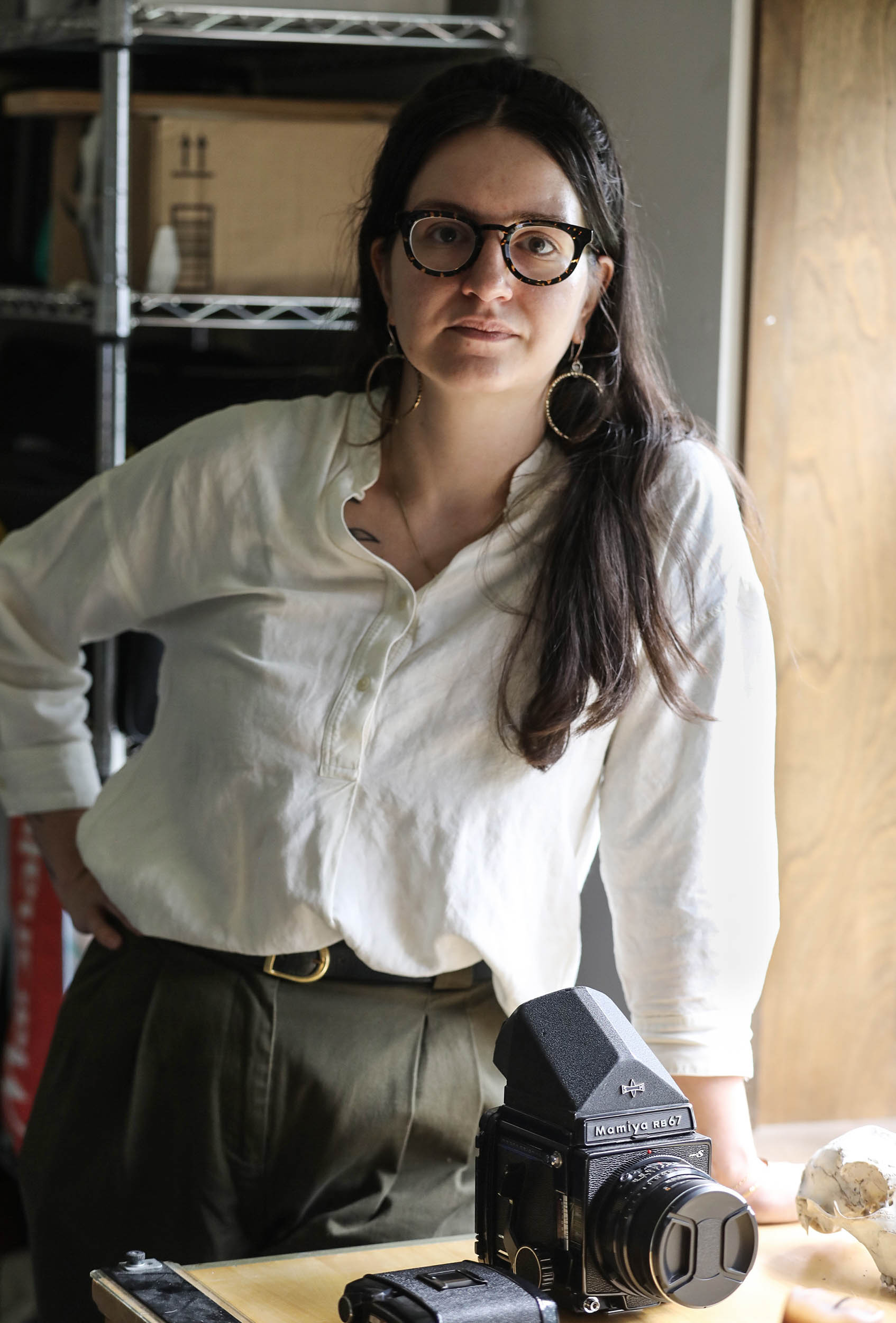 Clara Riedlinger in her studio at Rochester Contemporary Art Center is one of the Erie Canal artists in residence. She is a photographer and uses different format cameras from film to digital and also includes video.