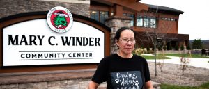 Beading Wolves founder Mary Homer stands outside the Mary C. Winder Community Center in Oneida, New York, where she regularly designs and produces her fashion and jewelry lines.