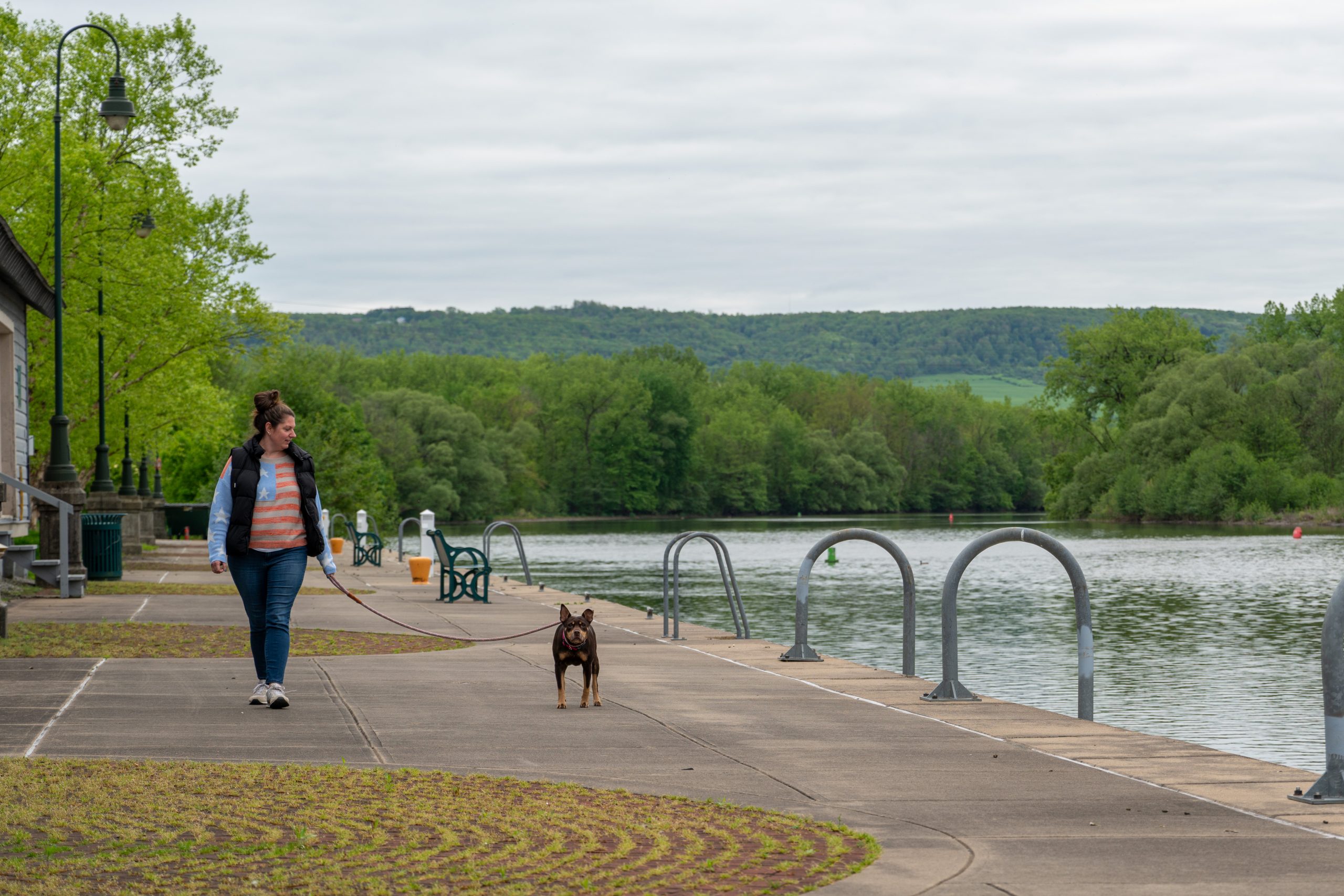 A resident walks her dog near Canal Lock 17 in Little Falls, New York