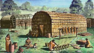 Illustration depicts Native Americans as they work among longhouses at various tasks in an unidentified Iroquois village.